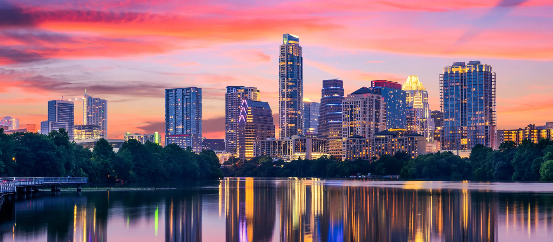 Downtown Austin skyline reflected across Lady Bird Lake